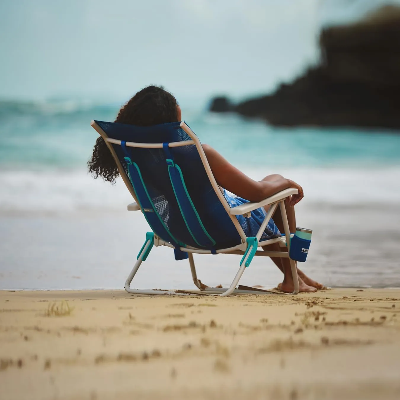 Shibumi Beach Chair. Anti-Rust Marine Grade Frame. 300lb Capacity. Weighs 8 Pounds. Adjustable Padded Backpack Straps. Breathable DreamWave Fabric.