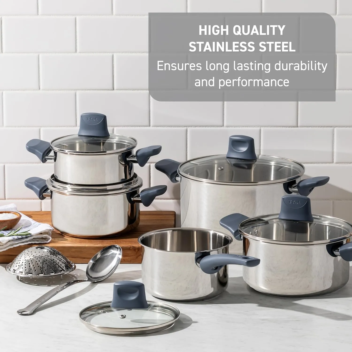 T-fal Essentials Stainless Steel Cookware Set 12 Piece, Induction Compatible, Oven Safe 350F, Cooking Set w/Stewpots, Stockpot, Saucepan, Lids & Tools, Measuring Marks, Dishwasher Safe, Silver/Blue